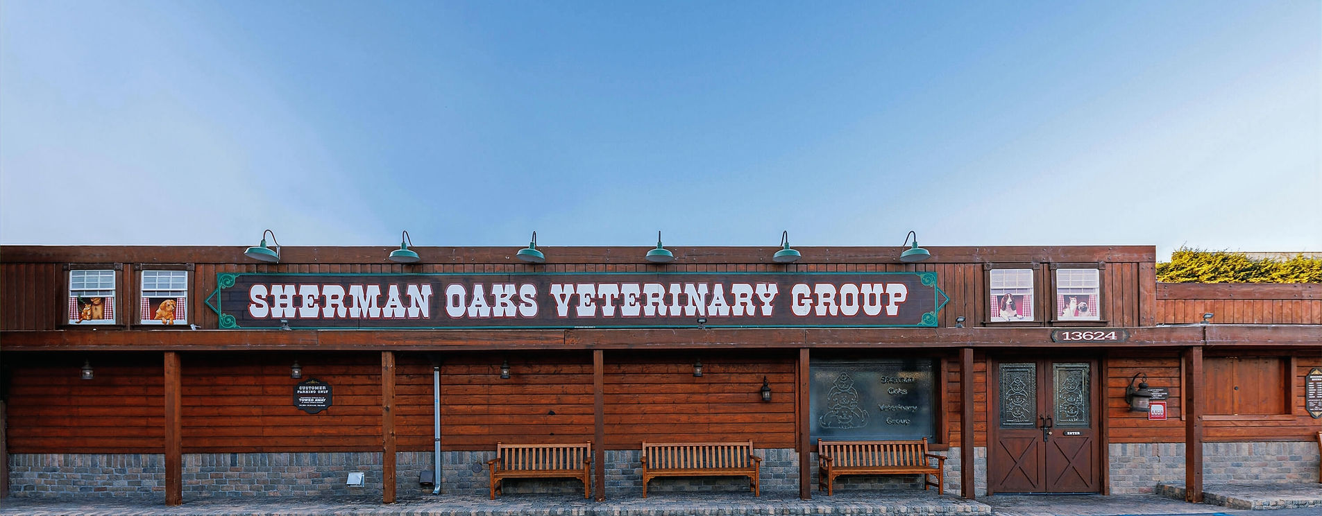 The Sherman Oaks Veterinary Group hospital on Moorpark Street, its painted sign above the benches at the front door.